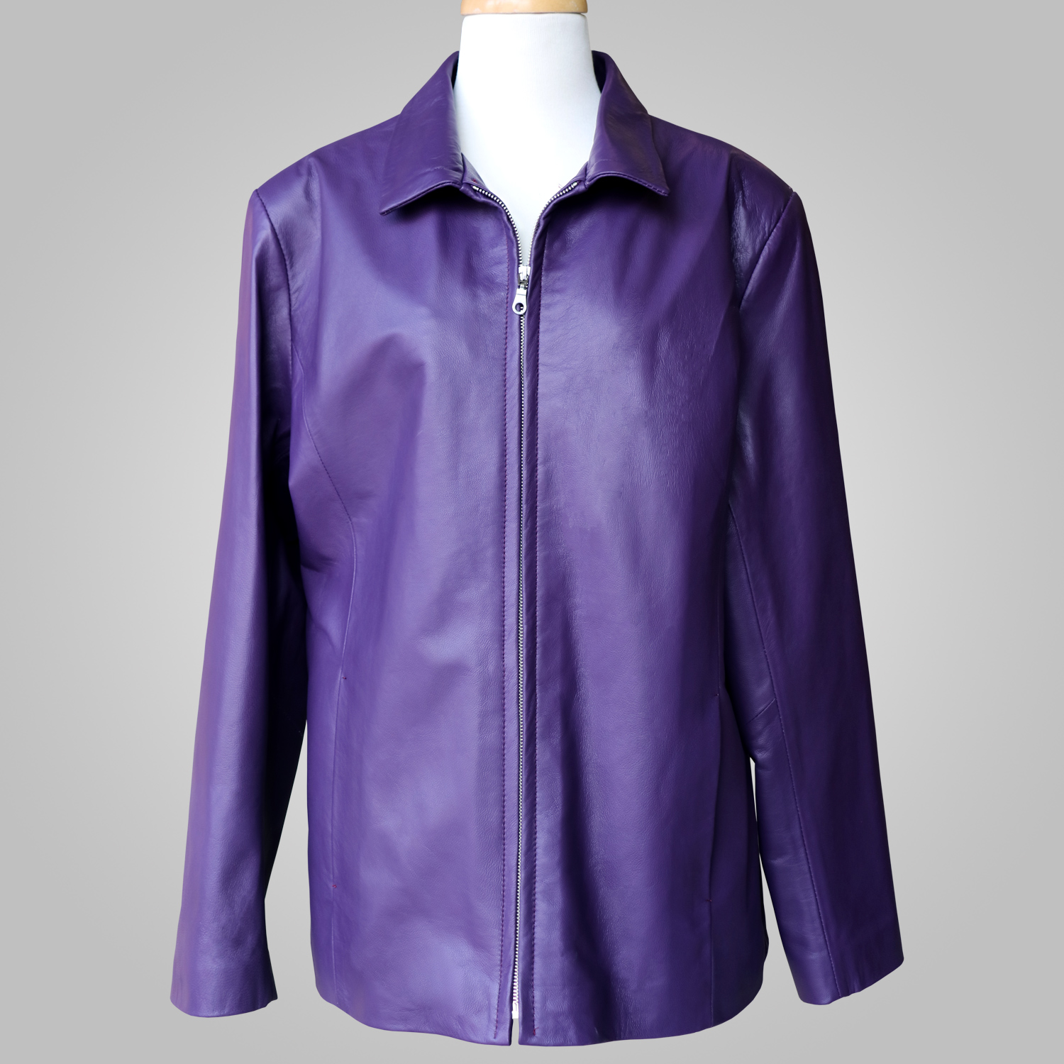 Women’s dark purple leather jacket with collar and front zip on a mannequin